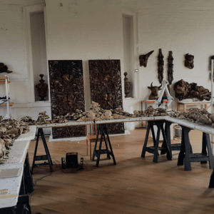 Grinling Gibbons' wooden carvings laid out on trestles during conservation work